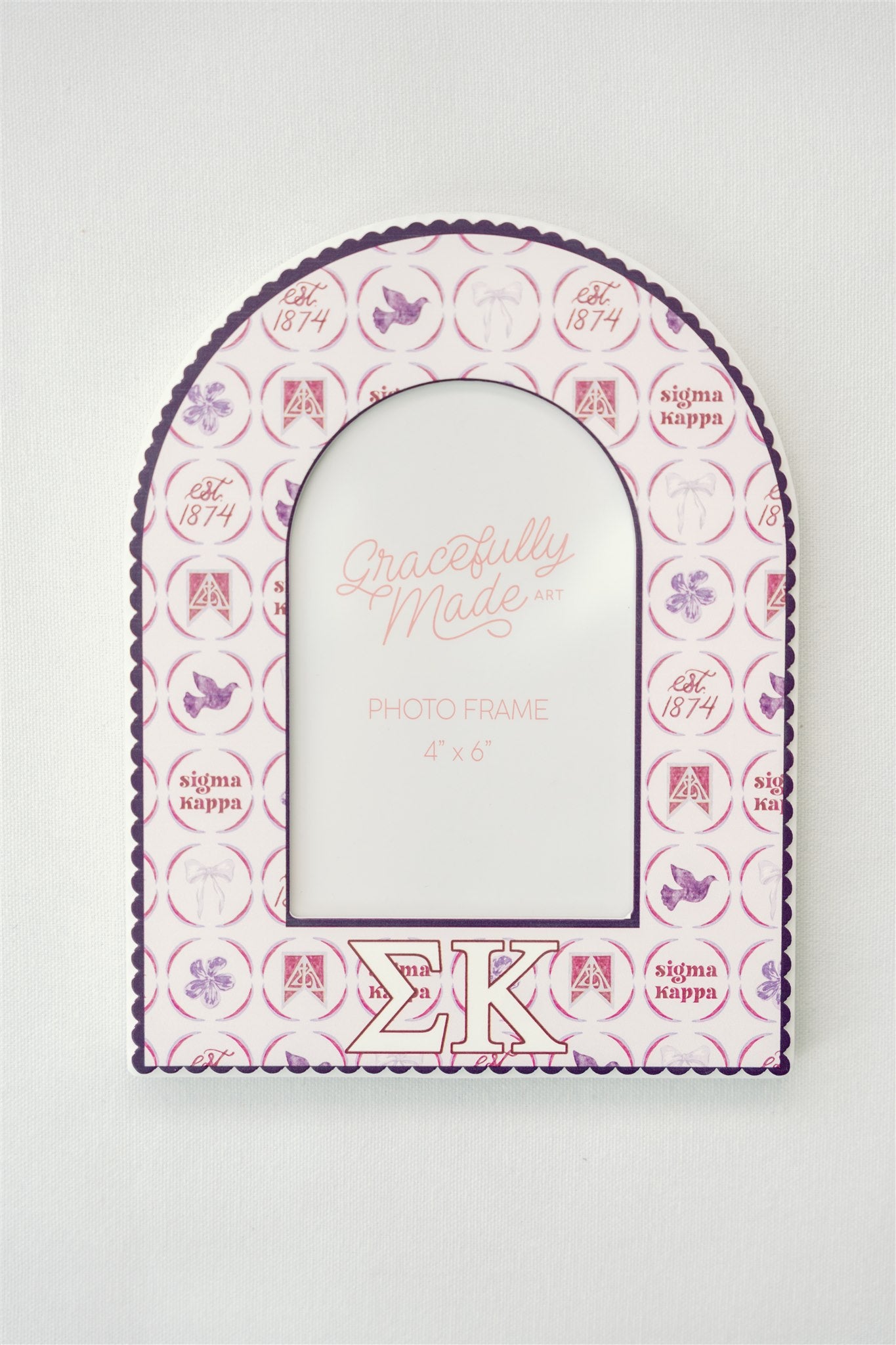 Decorative photo frame with Sigma Kappa Greek letters and watercolor pattern on a white background.