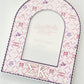 Decorative frame with Sigma Kappa Greek letters and pattern on a white background.