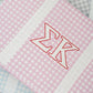 Close up of the purple gingham pattern on this Sigma Kappa tote bag.