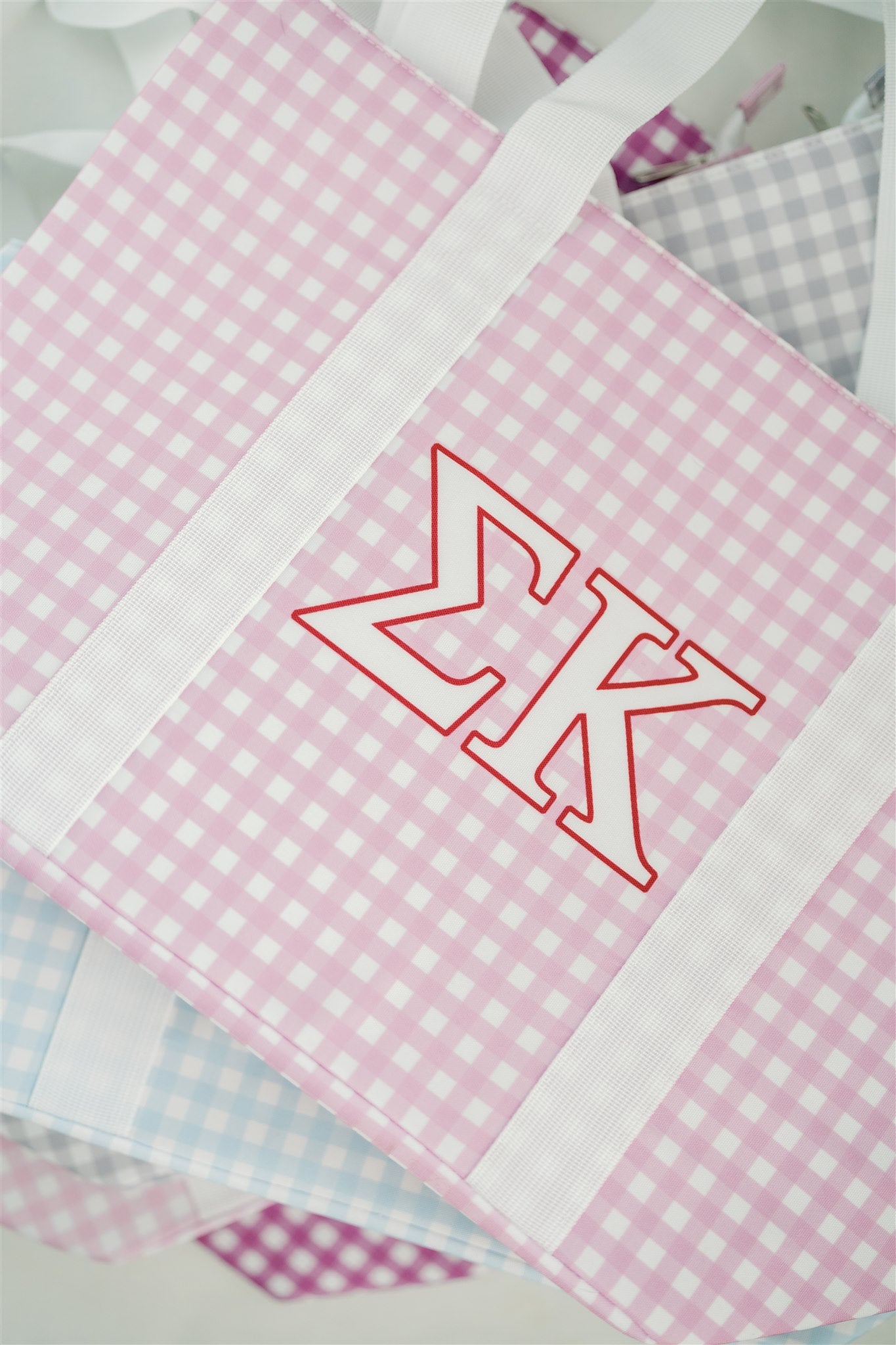 Close up of the purple gingham pattern on this Sigma Kappa tote bag.