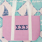 Purple gingham tote bag with blue Tri Sigma Greek letters on a patterned background