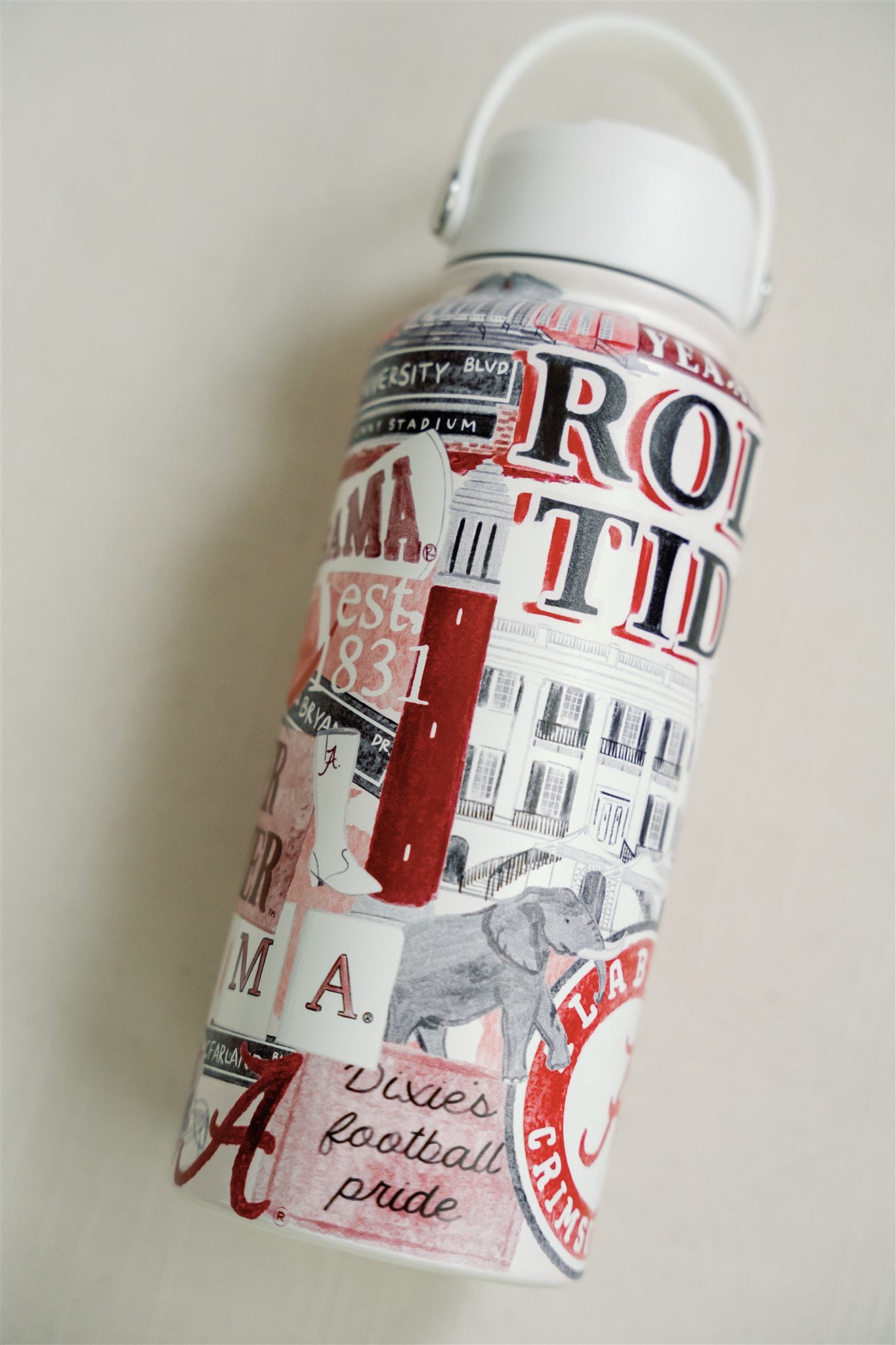 32 ounce Insulated Water Bottle with watercolor pattern of Alabama symbols and a white lid.