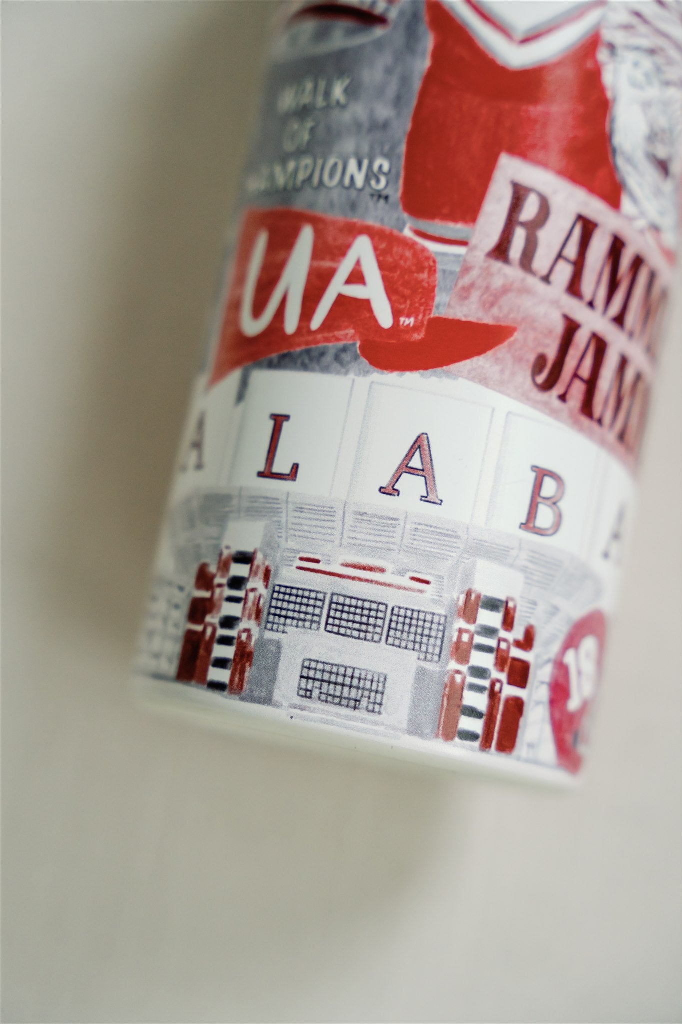 32 ounce Insulated Water Bottle with watercolor pattern of Alabama symbols and a white lid.
