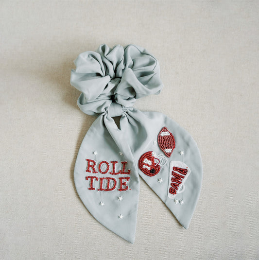 Light grey scrunchie with beaded University of Alabama symbols on the ribbons.