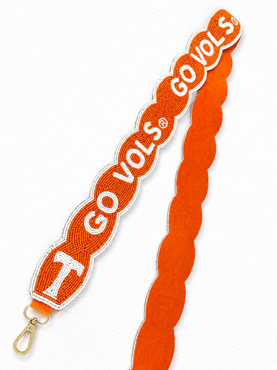 An orange and white beaded 'GO VOLS' purse strap with a gold-tone clasp, shown on a white background.