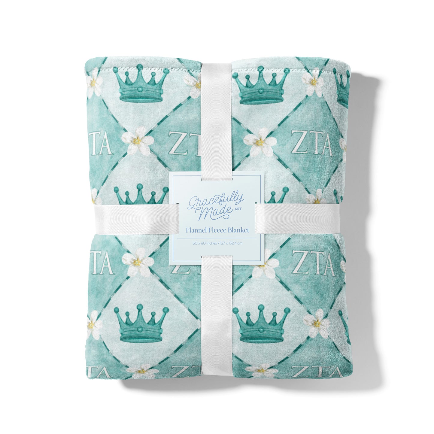 Blue checkered fleece blanket themed to Zeta Tau Alpha sorority packaged with white ribbon.
