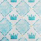 Patterned fabric with blue crowns and 'ZTA' Greek letters on a blue and white checkered background.