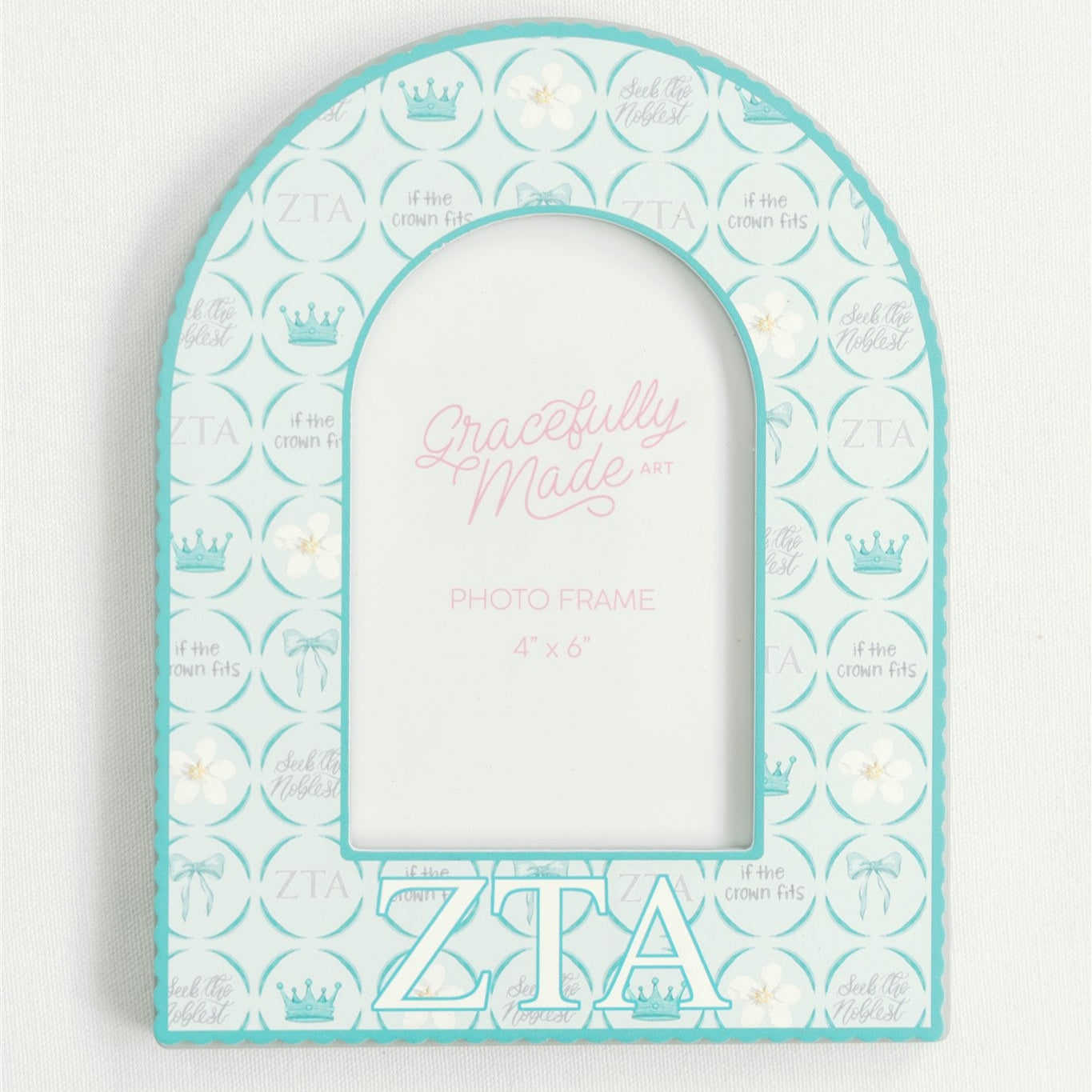 Decorative arch-shaped frame with Zeta Tau Alpha Greek letters and pattern on a white background